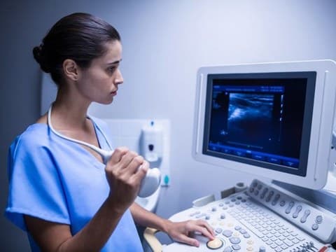 Sonographer performing an ultrasound scan